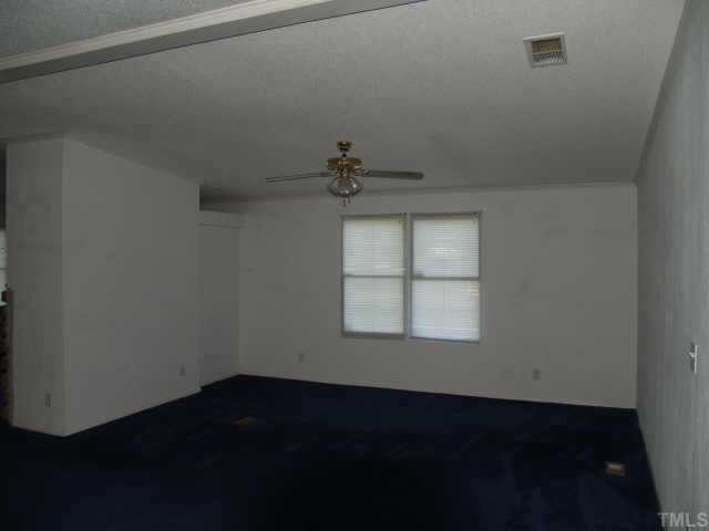 3633 Macedonia Road Spring Hope, NC 27882 - Photo 4 of 6 an empty room with a window