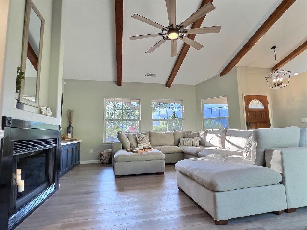 45233 Mineral King Road Three Rivers, CA 93271 - Photo 3 of 39 a living room with furniture and a flat screen tv