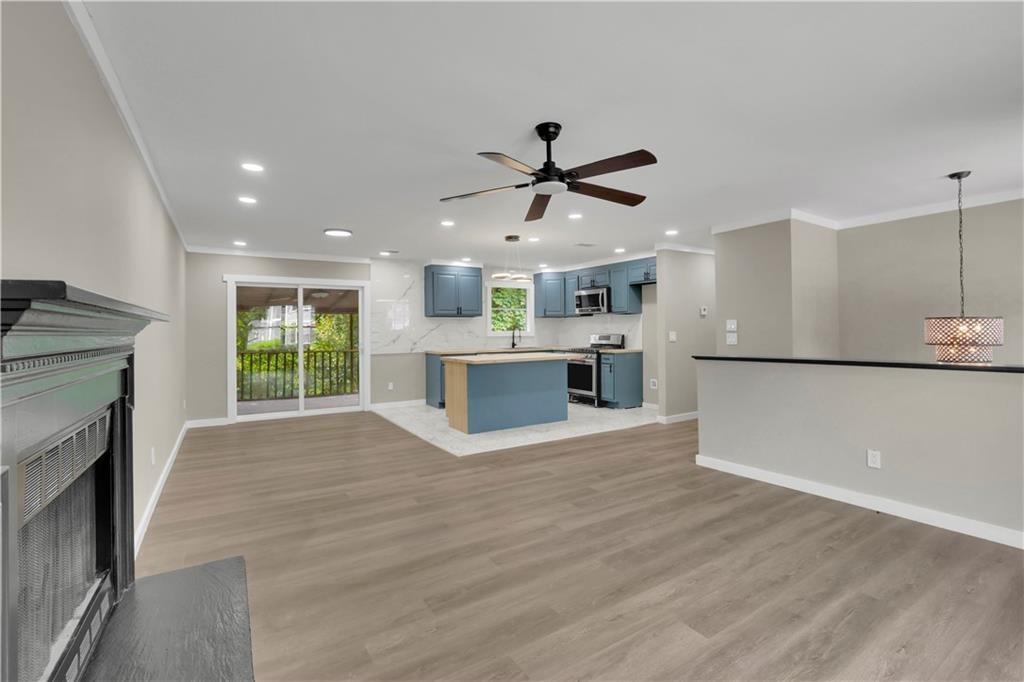 4913 Windsor Downs Drive Decatur, GA 30035 - Photo 11 of 26 a view of a kitchen with a sink and a fireplace
