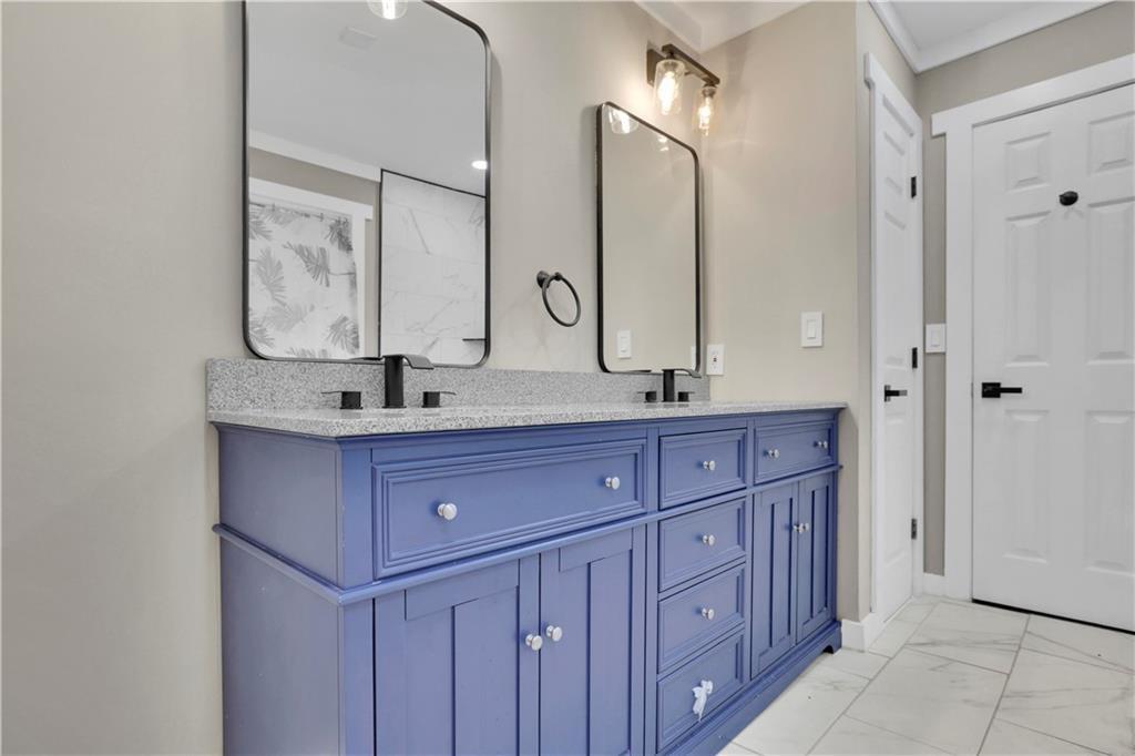 4913 Windsor Downs Drive Decatur, GA 30035 - Photo 21 of 26 a bathroom with a granite countertop double vanity sink mirror and