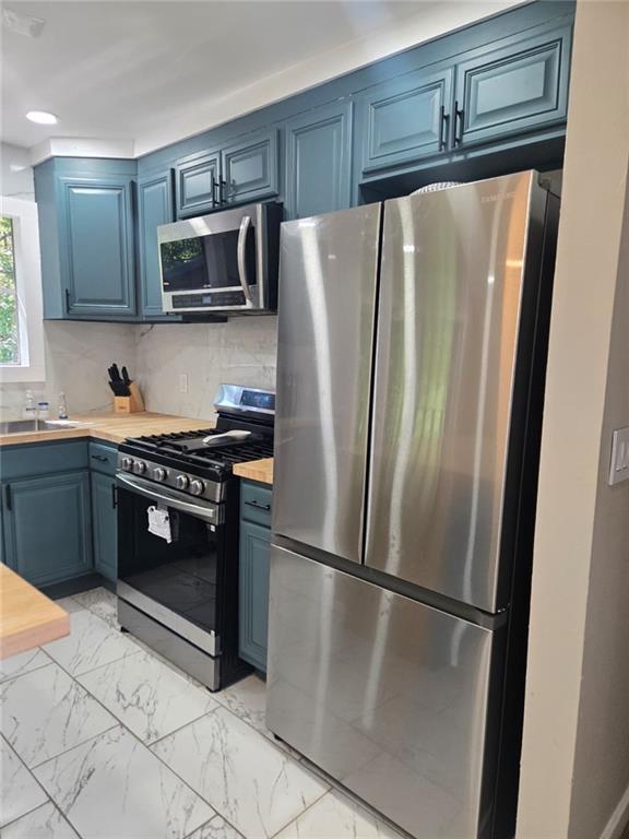 4913 Windsor Downs Drive Decatur, GA 30035 - Photo 8 of 26 a kitchen with stainless steel appliances a refrigerator sink and microwave