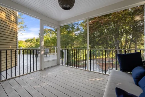 a view of a balcony with wooden floor