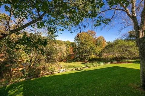 a view of yard with swimming pool