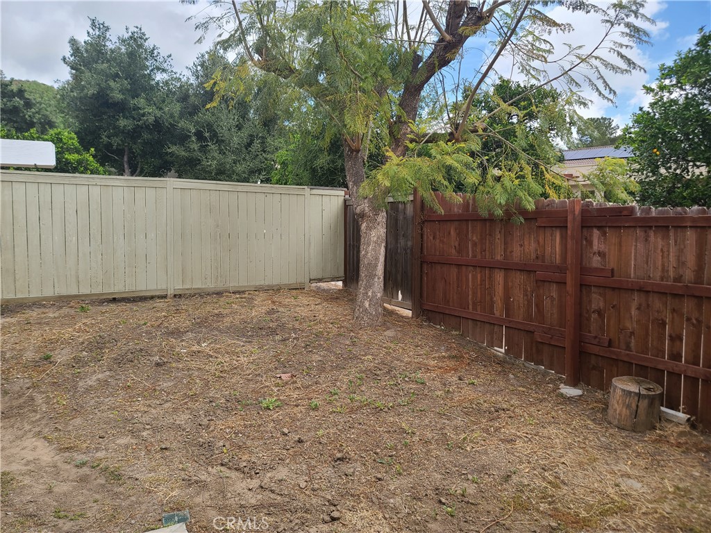 Undisclosed Address Simi Valley, CA 93063 - Photo 3 of 17 a view of backyard with wooden fence