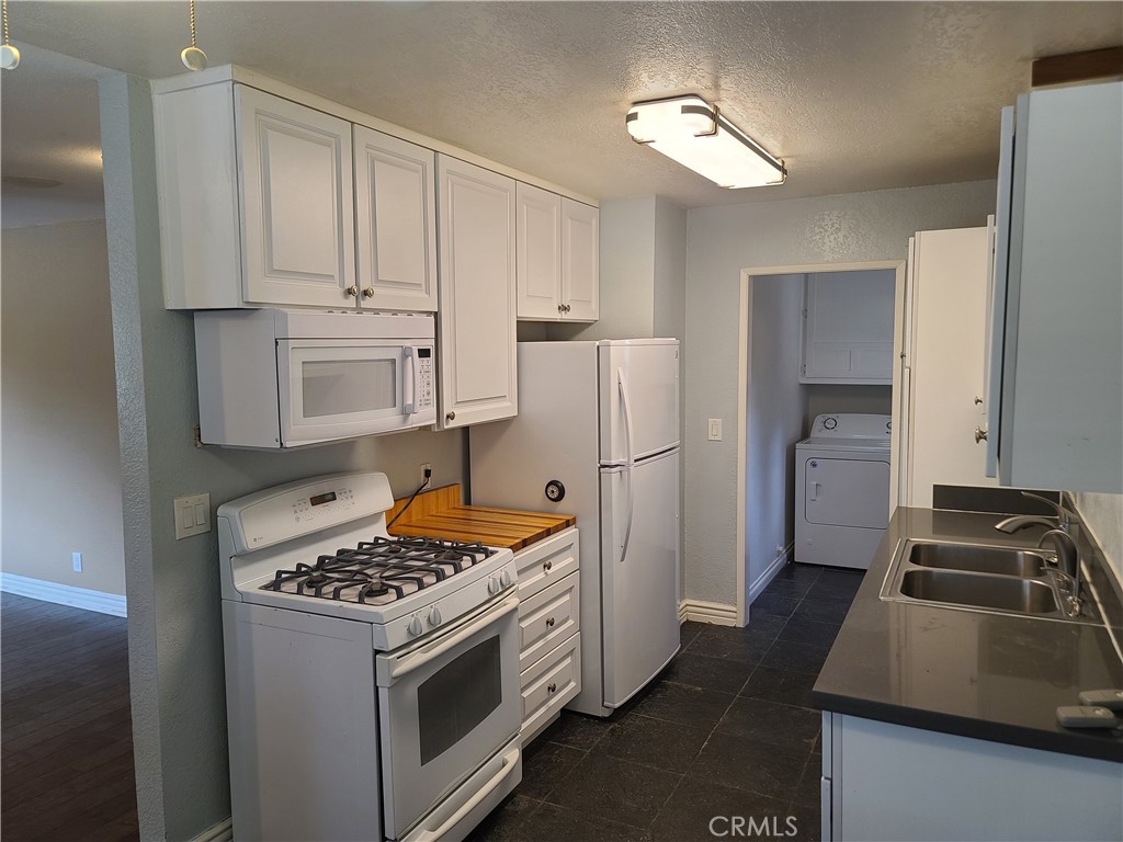 Undisclosed Address Simi Valley, CA 93063 - Photo 9 of 17 a kitchen with a refrigerator and a stove