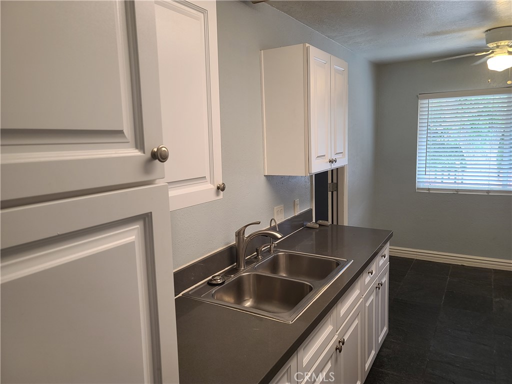 Undisclosed Address Simi Valley, CA 93063 - Photo 10 of 17 a kitchen with a sink and a stove top oven