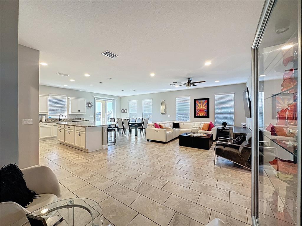 115 Silver Maple Road Groveland, FL 34736 - Photo 12 of 79 a living room with furniture and kitchen view