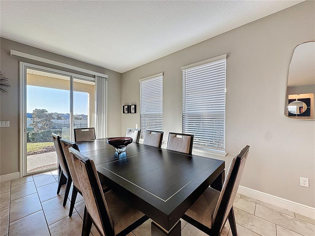 115 Silver Maple Road Groveland, FL 34736 - Photo 20 of 79 a view of a dining room with a table and chairs