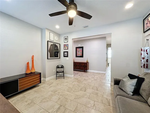 an aerial view of residential houses with outdoor space and parking