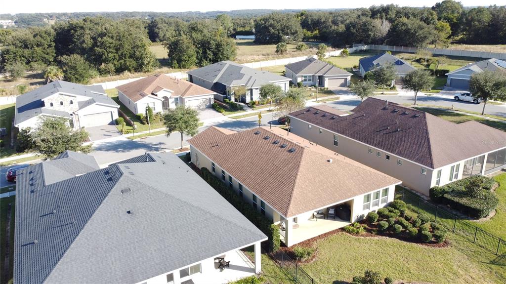 115 Silver Maple Road Groveland, FL 34736 - Photo 52 of 79 an aerial view of residential houses with outdoor space