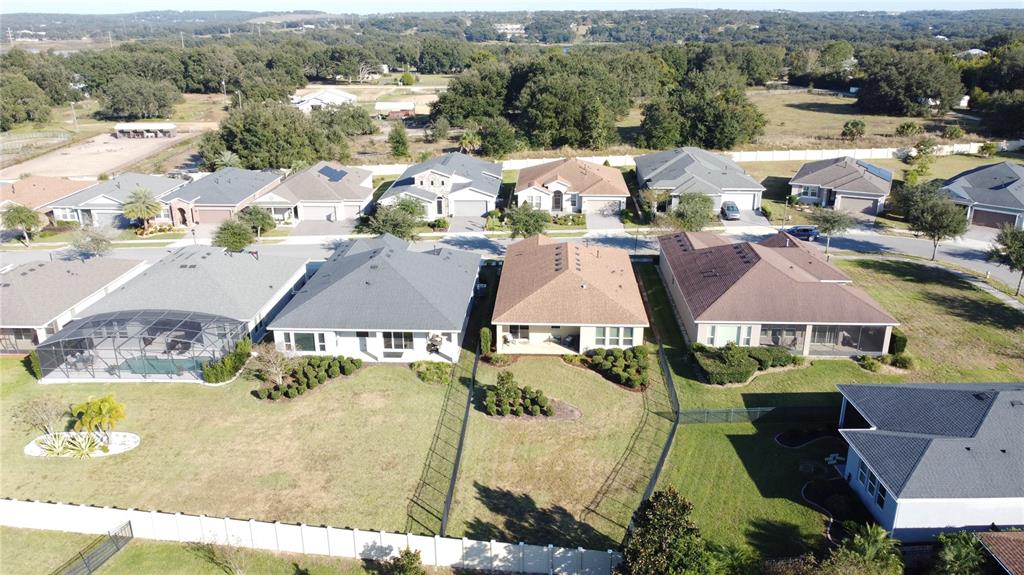 115 Silver Maple Road Groveland, FL 34736 - Photo 55 of 79 an aerial view of residential houses with outdoor space