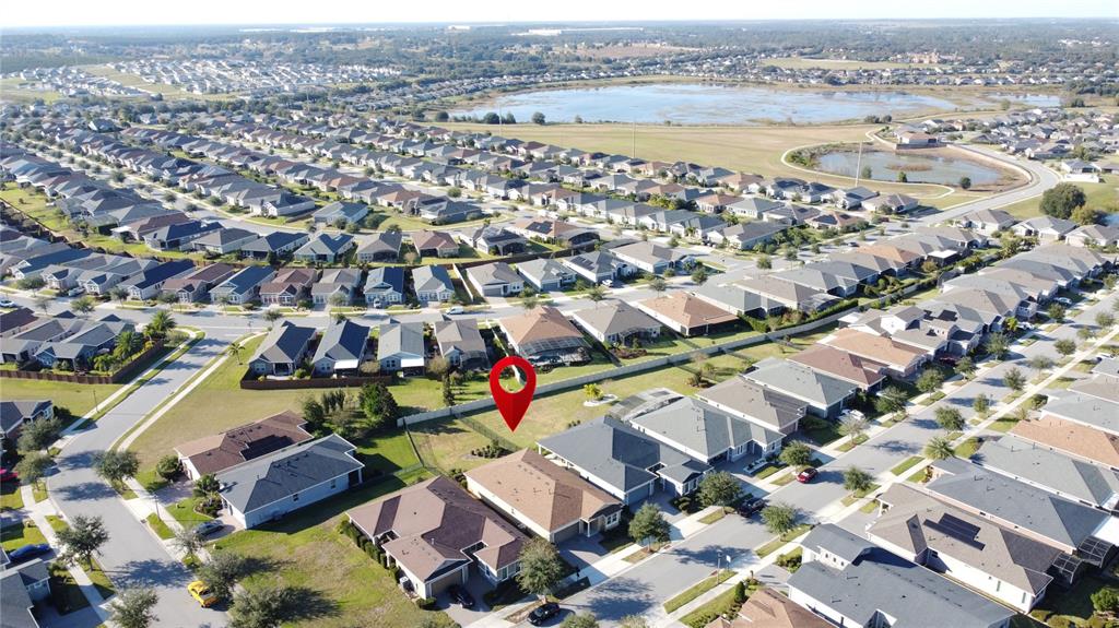 115 Silver Maple Road Groveland, FL 34736 - Photo 57 of 79 an aerial view of residential houses with outdoor space