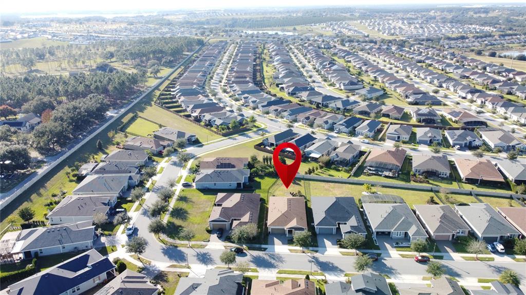 115 Silver Maple Road Groveland, FL 34736 - Photo 62 of 79 an aerial view of residential houses with outdoor space