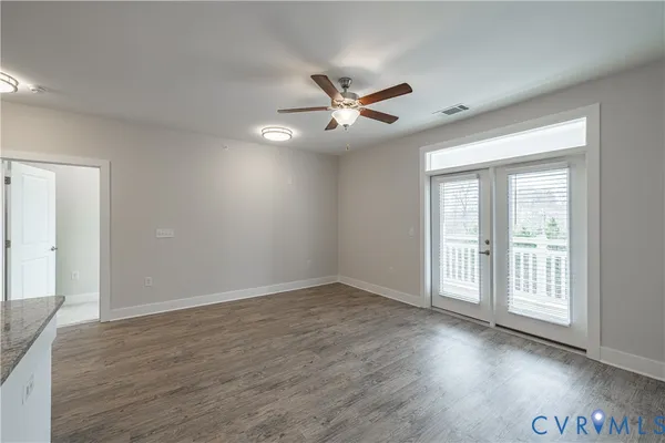 a kitchen with stainless steel appliances granite countertop a sink a stove top oven a counter space and cabinets