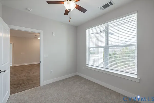 a view of an empty room with a window