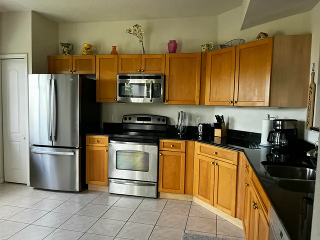 a view of a kitchen with a sink and a microwave