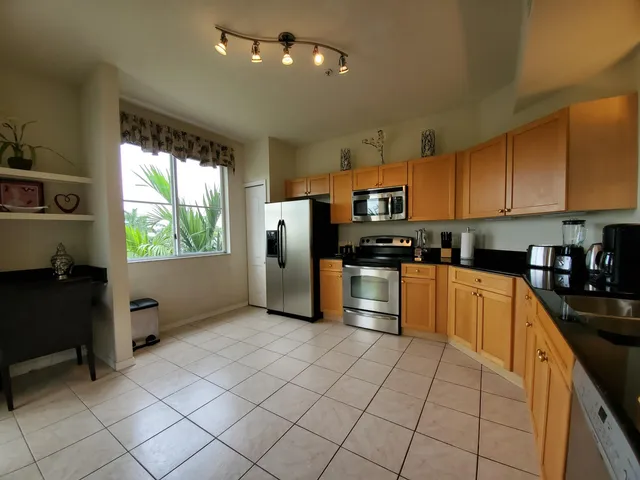 a balcony with table and chairs