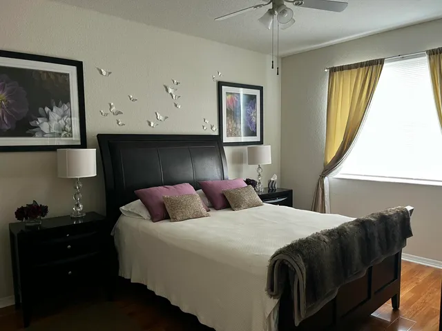 a bathroom with a toilet and a shower curtain