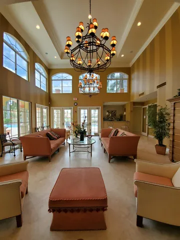 a front view of a residential apartment building with a yard