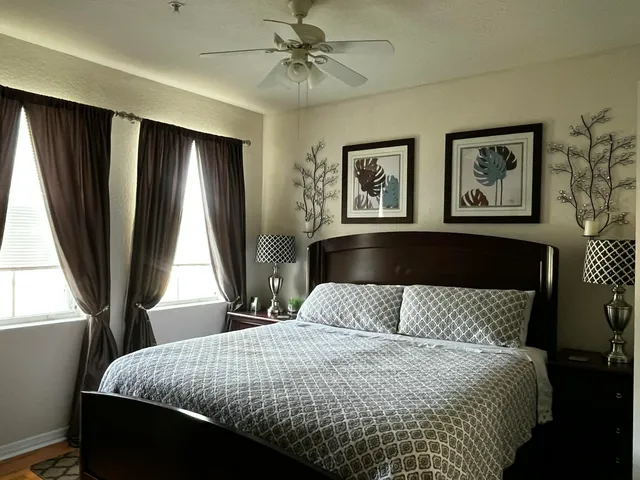 a view of a room with wooden floor