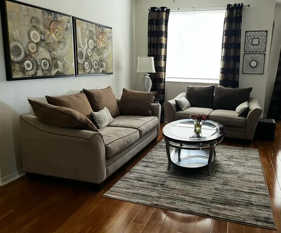 a dining room with furniture and window