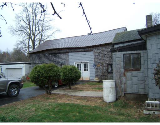 4 Old Mill Road Sutton, MA 01590 - Photo 4 of 6 a house view with a garden space