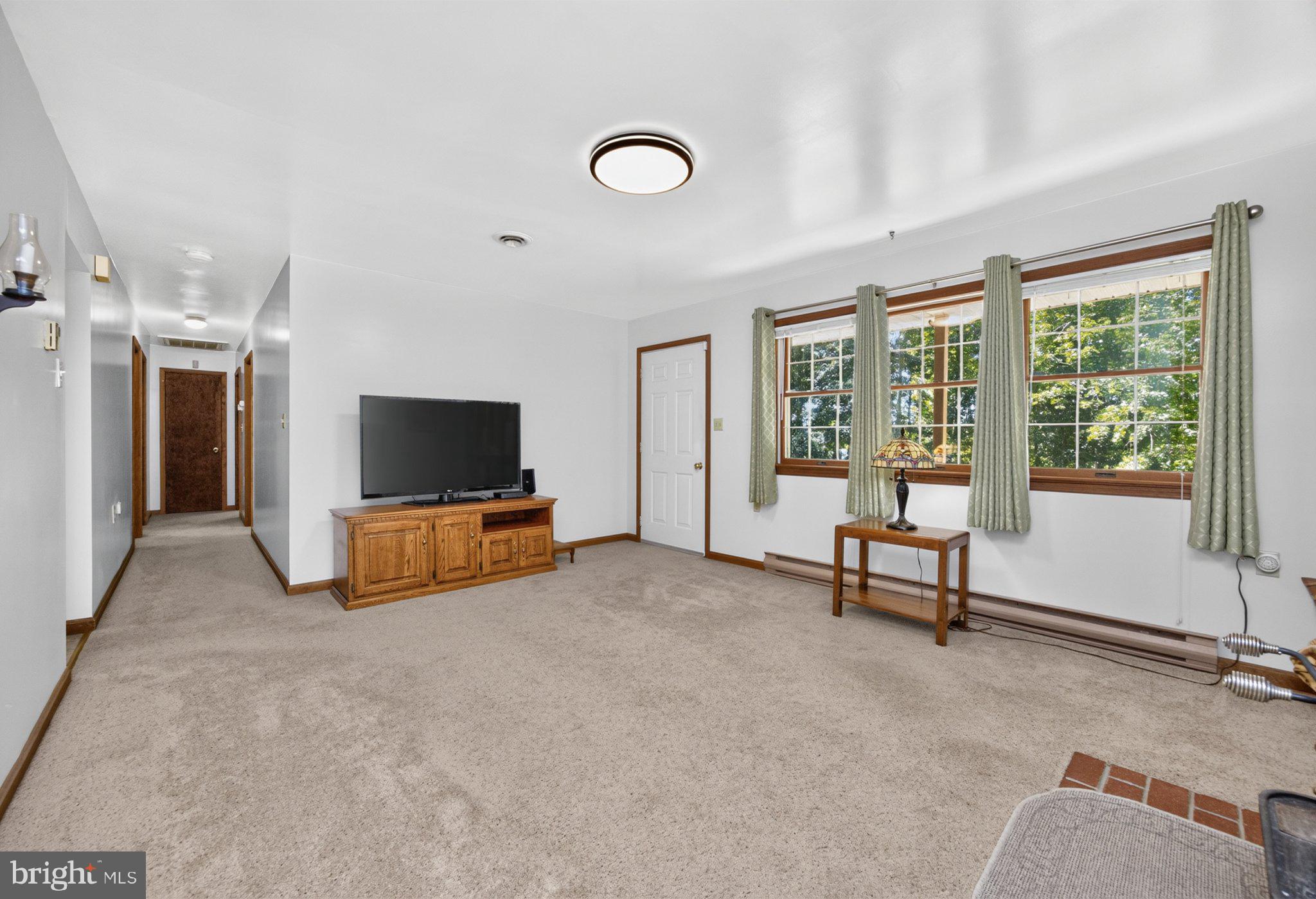 725 Ewing Road Cochranville, PA 19330 - Photo 14 of 55 Let's walk down the hallway to the beds/baths