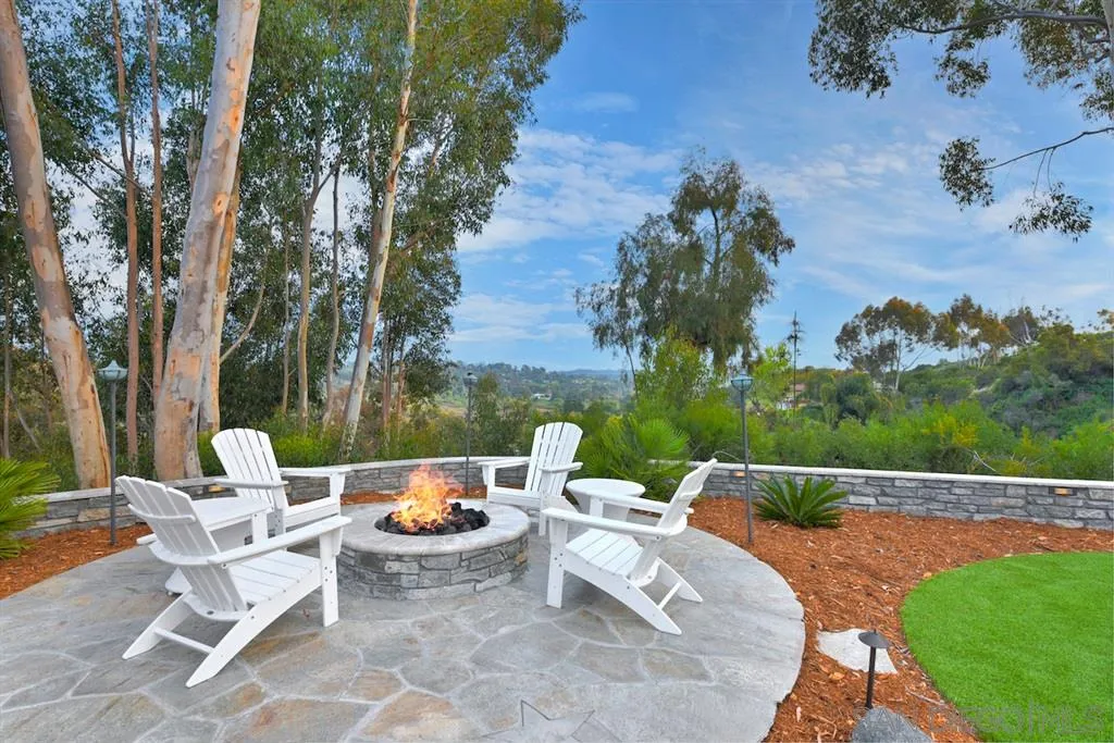133 Hummingbird Hill Encinitas, CA 92024 - Photo 20 of 25 an outdoor sitting area with furniture and garden view
