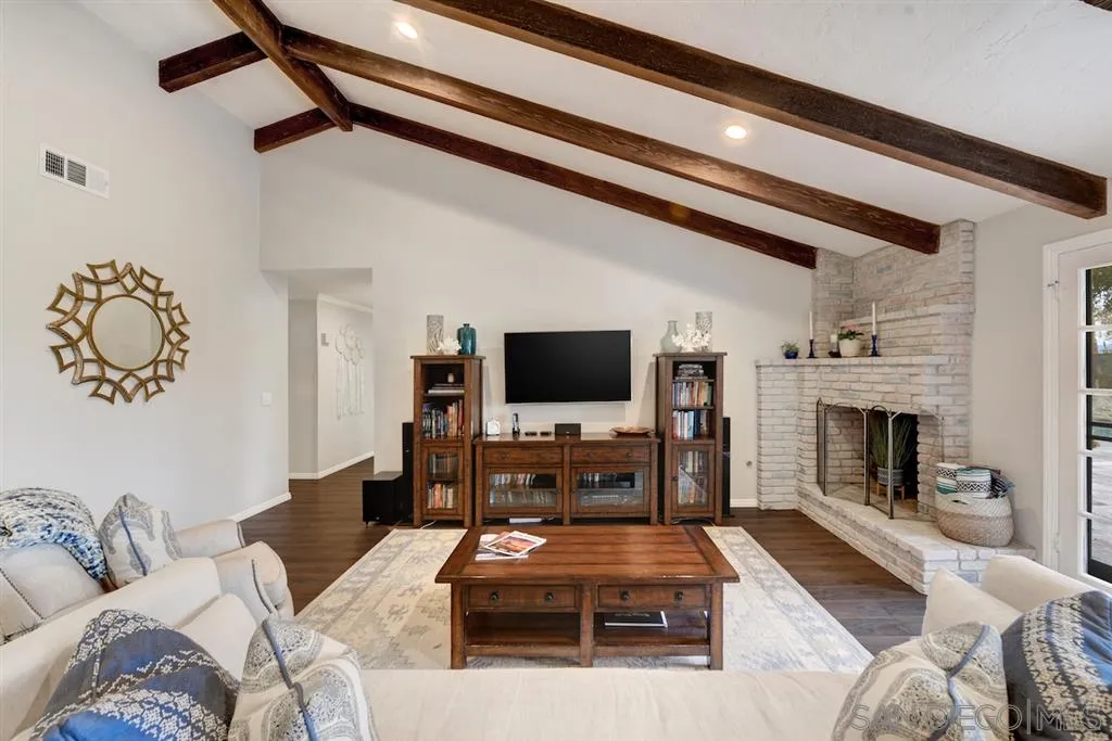 133 Hummingbird Hill Encinitas, CA 92024 - Photo 4 of 25 a living room with furniture fireplace and flat screen tv