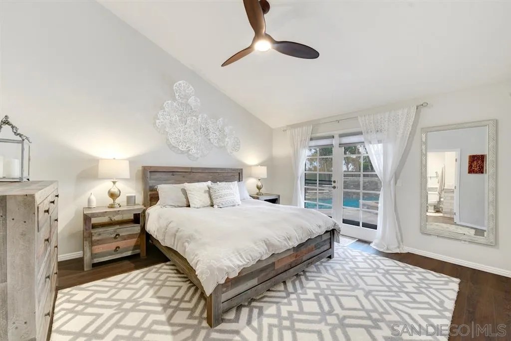 133 Hummingbird Hill Encinitas, CA 92024 - Photo 5 of 25 a bedroom with a large bed and a window