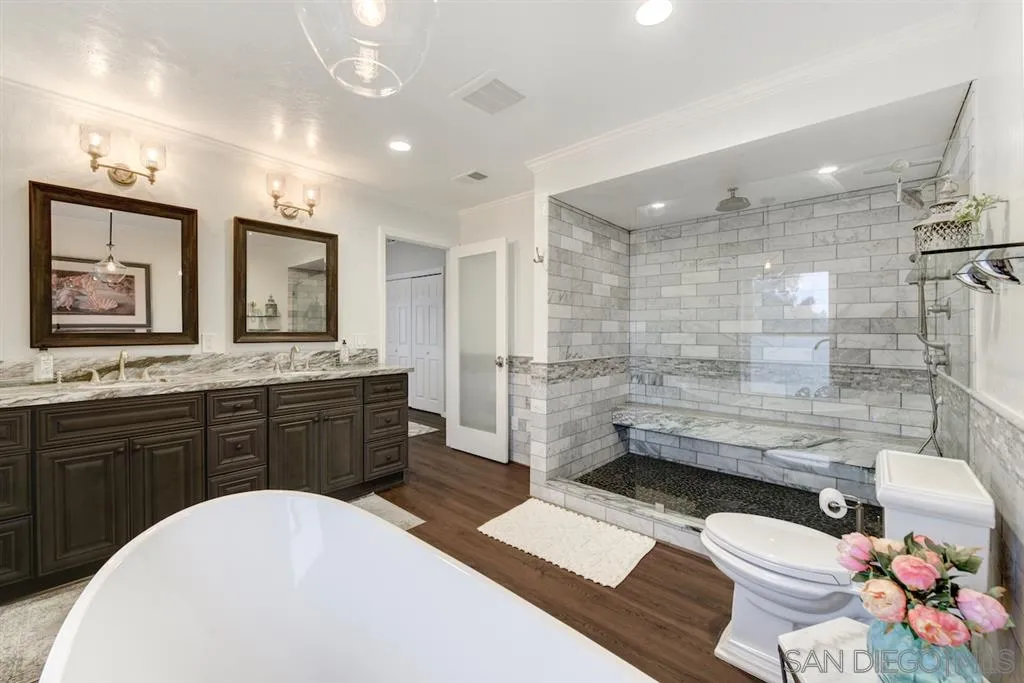 133 Hummingbird Hill Encinitas, CA 92024 - Photo 6 of 25 a bathroom with a sink a toilet and shower