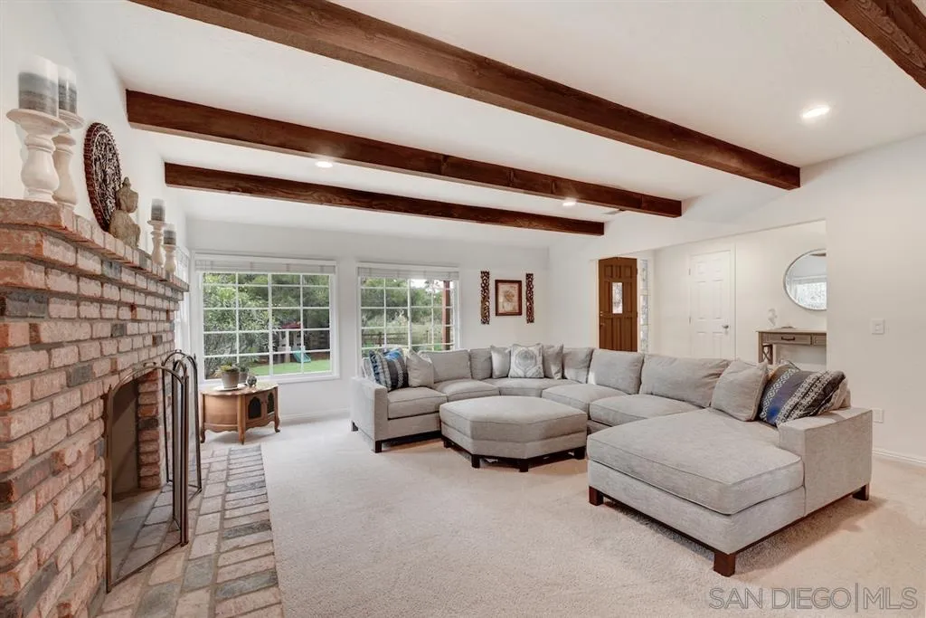 133 Hummingbird Hill Encinitas, CA 92024 - Photo 10 of 25 a living room with furniture and a fireplace
