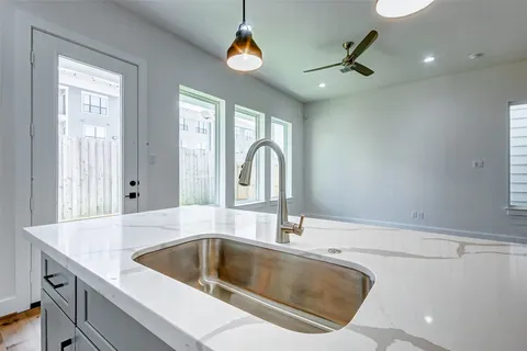 a kitchen with a sink and a stove
