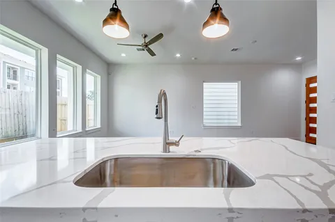 a kitchen with a sink and a window