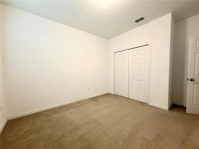 an empty room with closet
