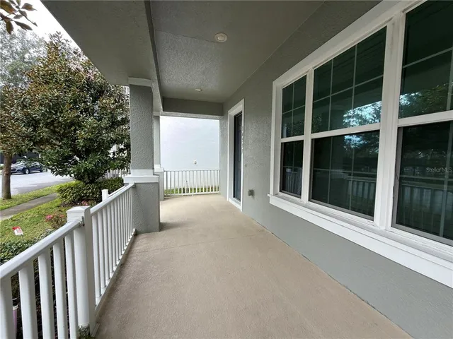 a view of a house with porch and wooden floor