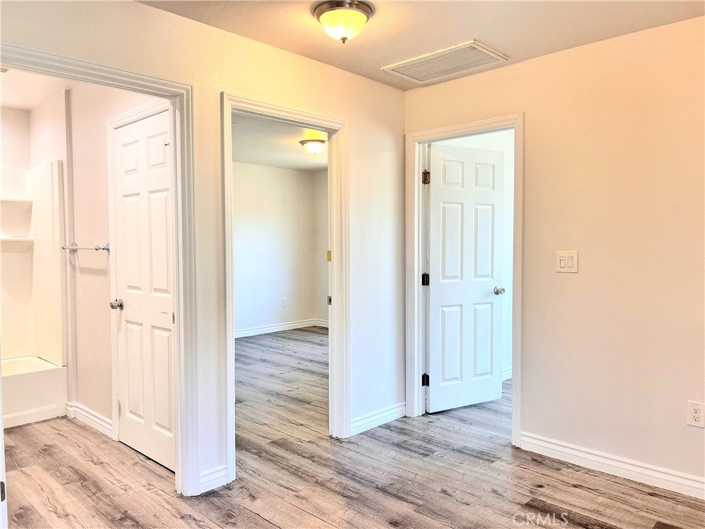 20009 Arminta Street Winnetka, CA 91306 - Photo 16 of 29 a view of a bathroom with wooden floor
