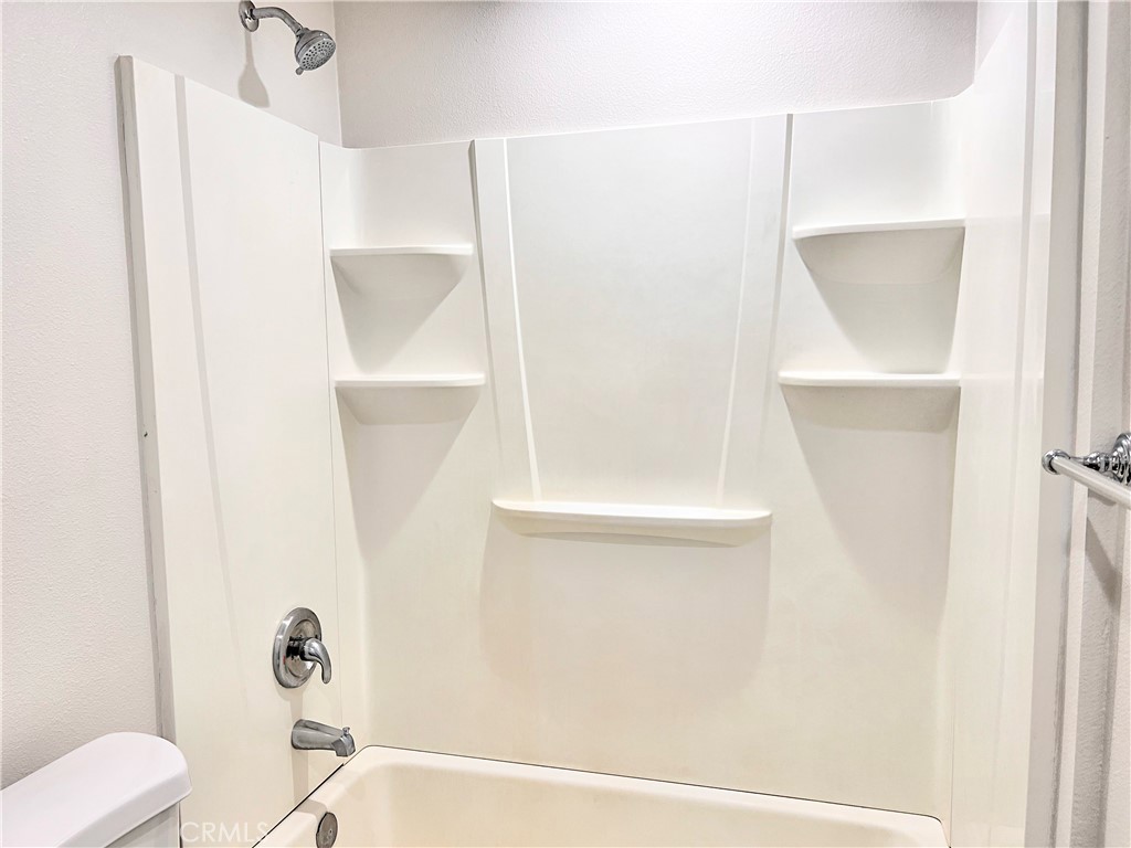 20009 Arminta Street Winnetka, CA 91306 - Photo 21 of 29 a bathroom with a shower and a toilet