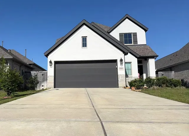 a front view of a house with yard