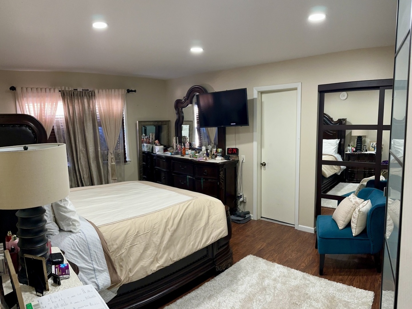 7008 O'Connell Drive, Unit 201 Chicago Ridge, IL 60415 - Photo 12 of 21 a bedroom with a bed and a mirror