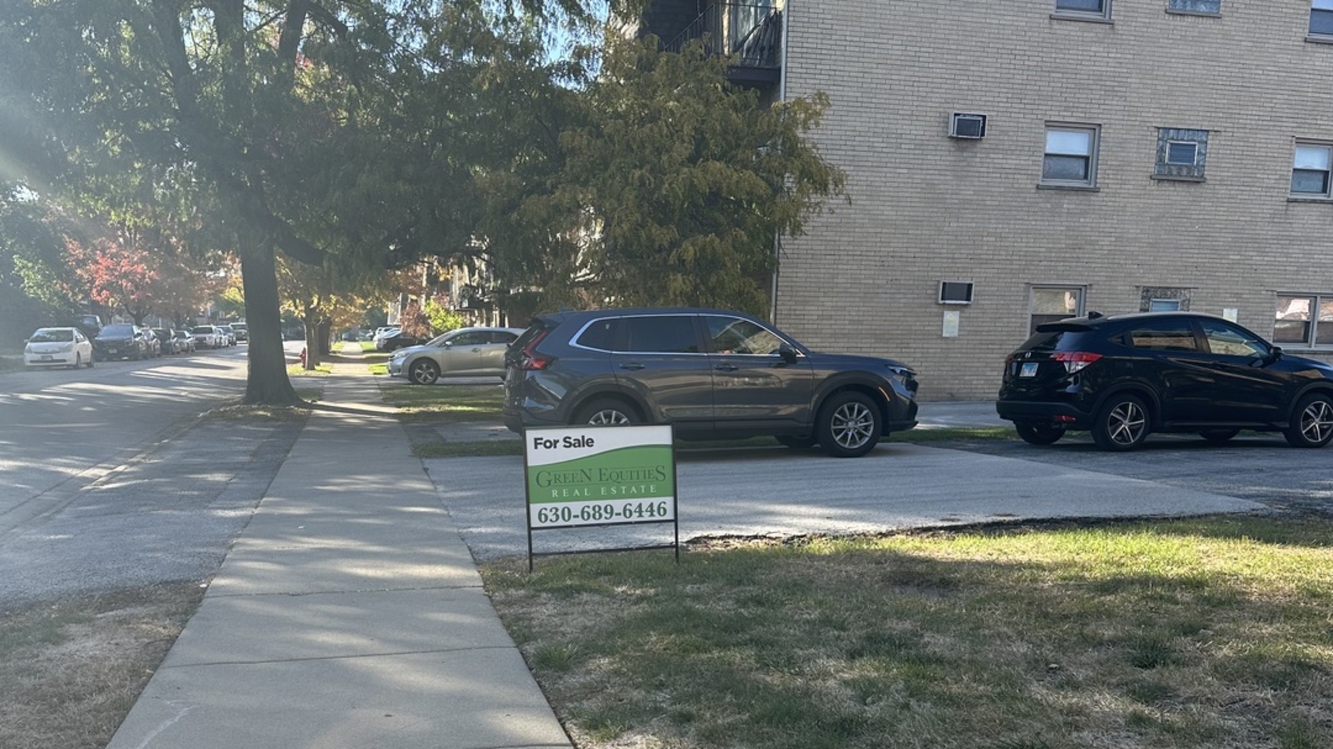 7008 O'Connell Drive, Unit 201 Chicago Ridge, IL 60415 - Photo 21 of 21 a view of a street with a bench and trees