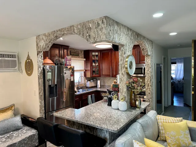 a kitchen with sink and refrigerator