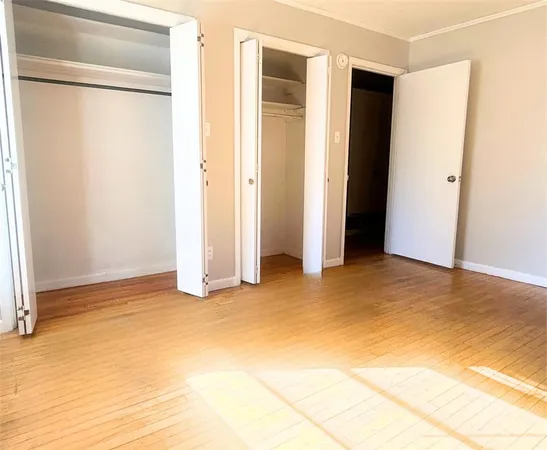 a view of empty room with closet