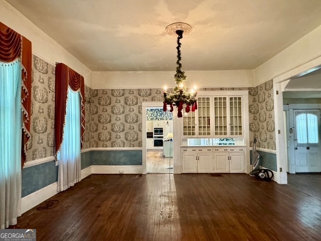 222 Church Street Lexington, GA 30648 - Photo 12 of 50 a view of empty room with wooden floor and outdoor view