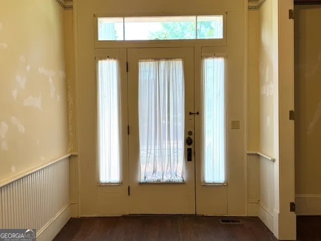 a kitchen with stainless steel appliances granite countertop a stove and a refrigerator