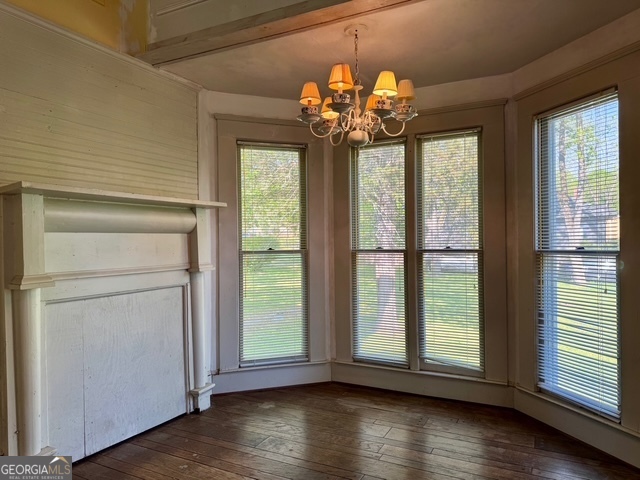 222 Church Street Lexington, GA 30648 - Photo 19 of 50 a view of a room with wooden floor and chandelier