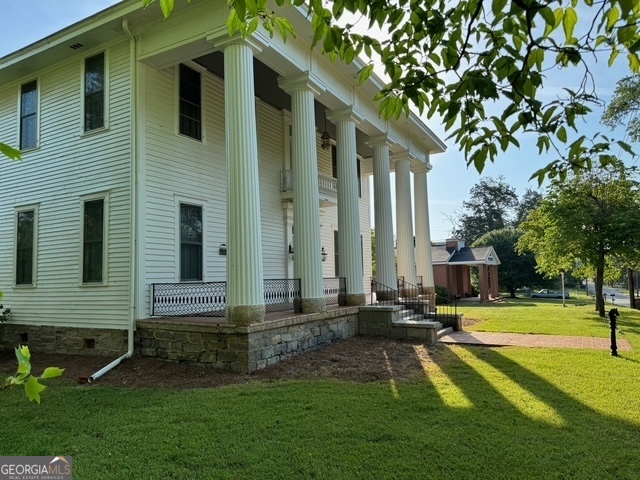 222 Church Street Lexington, GA 30648 - Photo 2 of 50 a front view of a house with a yard