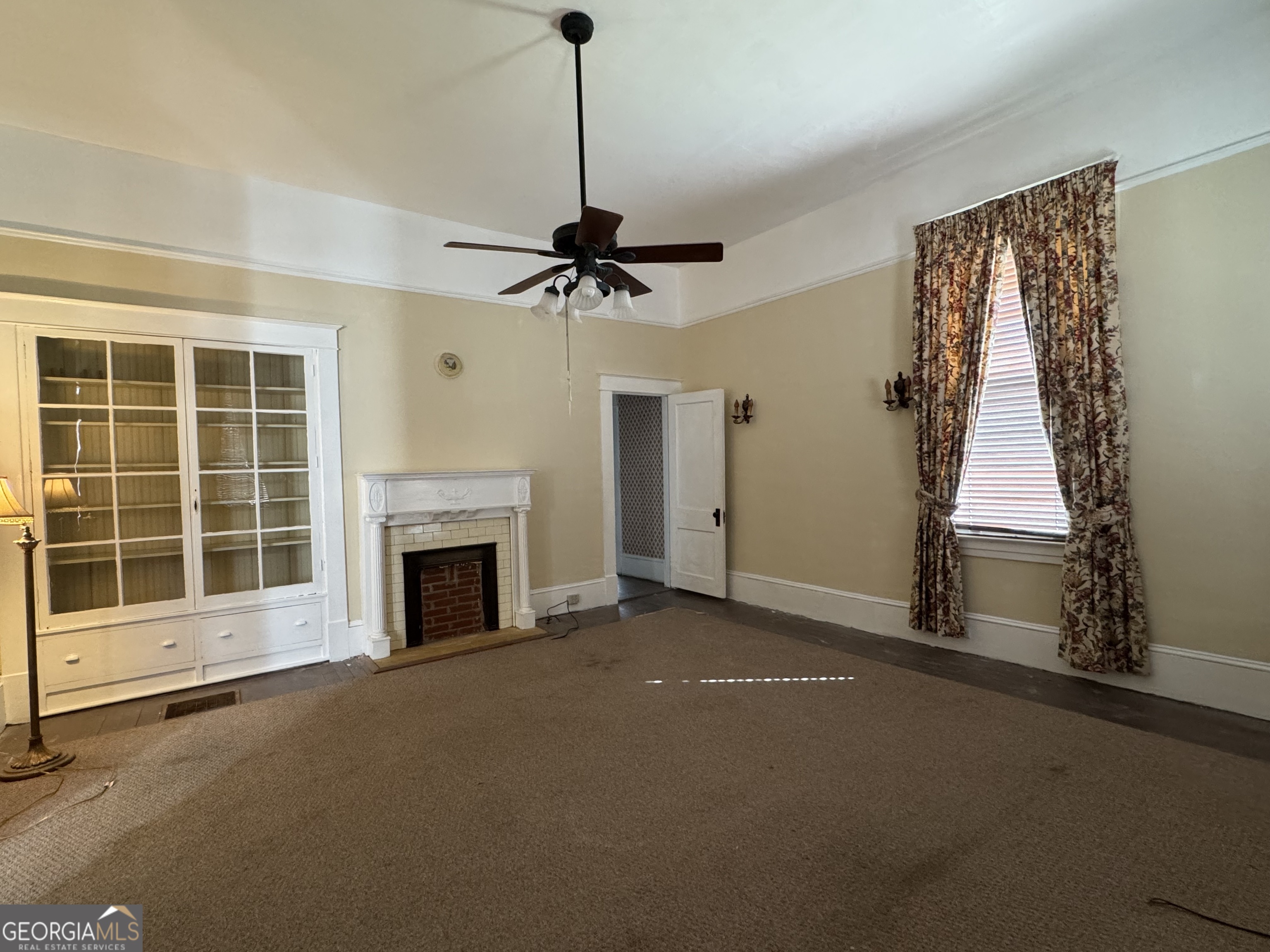 222 Church Street Lexington, GA 30648 - Photo 22 of 50 a view of a livingroom with a fireplace and window