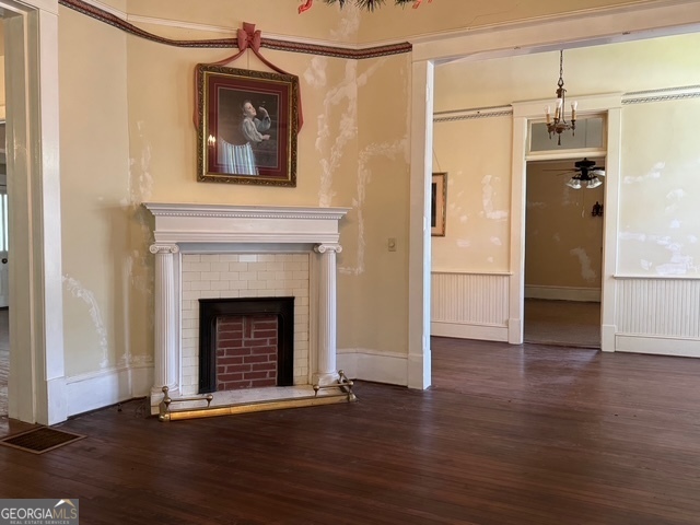 222 Church Street Lexington, GA 30648 - Photo 25 of 50 a view of a livingroom with wooden floor and a fireplace