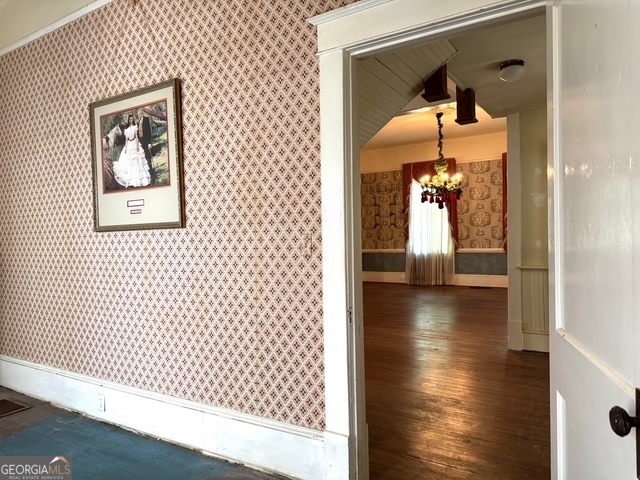 222 Church Street Lexington, GA 30648 - Photo 28 of 50 a view of a hallway with wooden floor and a dining room